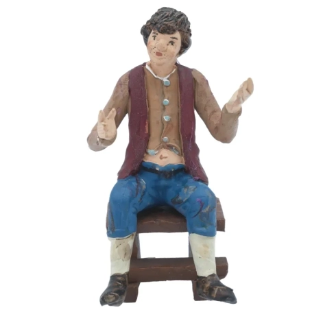 Uomo seduto in terracotta 12 cm