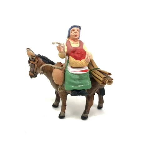 Donna che vende frutta seduta su asino in terracotta 7 cm