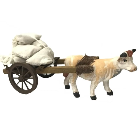 Mucca che trasporta sacchi 10 cm presepe