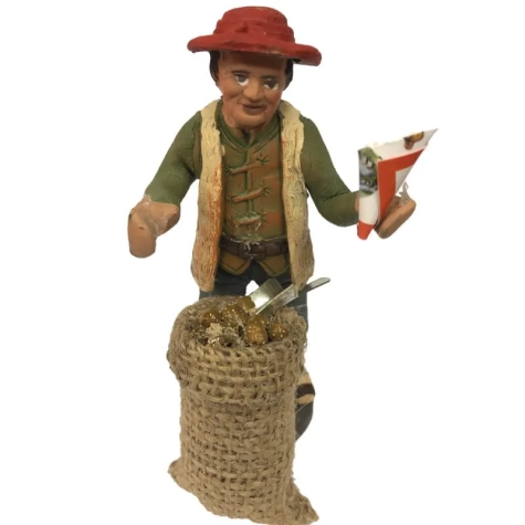 Uomo che vende frutta secca in terracotta 10 cm